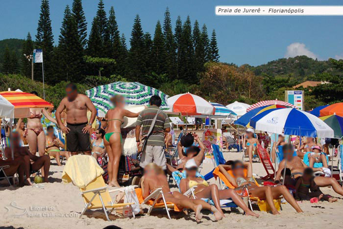 Galera tomando um sol na praia de jurere internacional em floripa