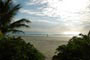 Restinga, Areia branquinha, Mar Calmo e uma pessoa sozinha passeando na Praia de Bombas em Bombinhas.