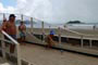 Senhoras e Senhores jogando bocha na praia central de Balneário Camboriú e ao fundo a ilha das cabras.