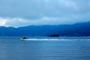 praia do sonho sc, pessoas andando calmamente de jet ski nas águas do litoral catarinense