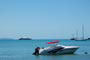 Praia de Porto Belo (Centro), barcos e ao fundo navios.