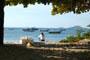 praia da enseada em sao francisco do sul, garota adimirando a paisagem desta linda praia catarinense